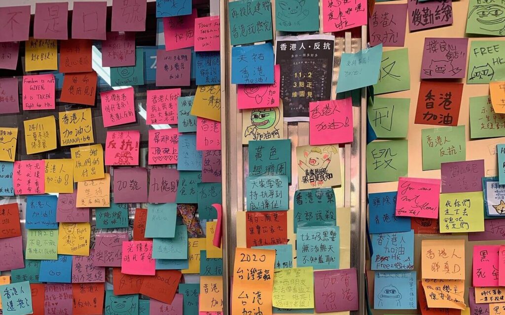  A wall adorned with colorful post-it notes, creating a vibrant and organized display.